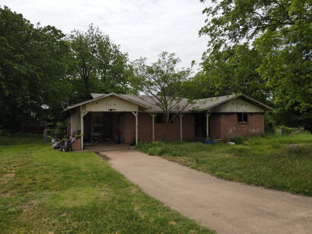 A front view of the home on Kinson Street in Granbury Texas that was destroyed by fire before the Wannco Services demolition contractor and team tore it down in preparation for the rebuild.