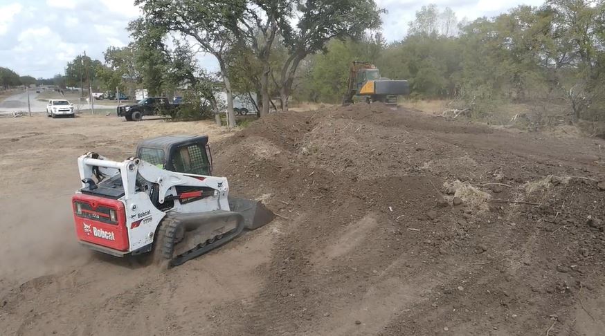 Construction site of a grader performing dirt work in Granbury