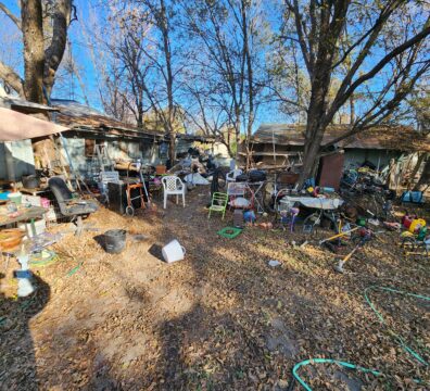 A dilapidated home in Glen Rose that is a severe hoarding situation. Showing lots of yard clutter around a home prior to a professional demolition company clearing it out.