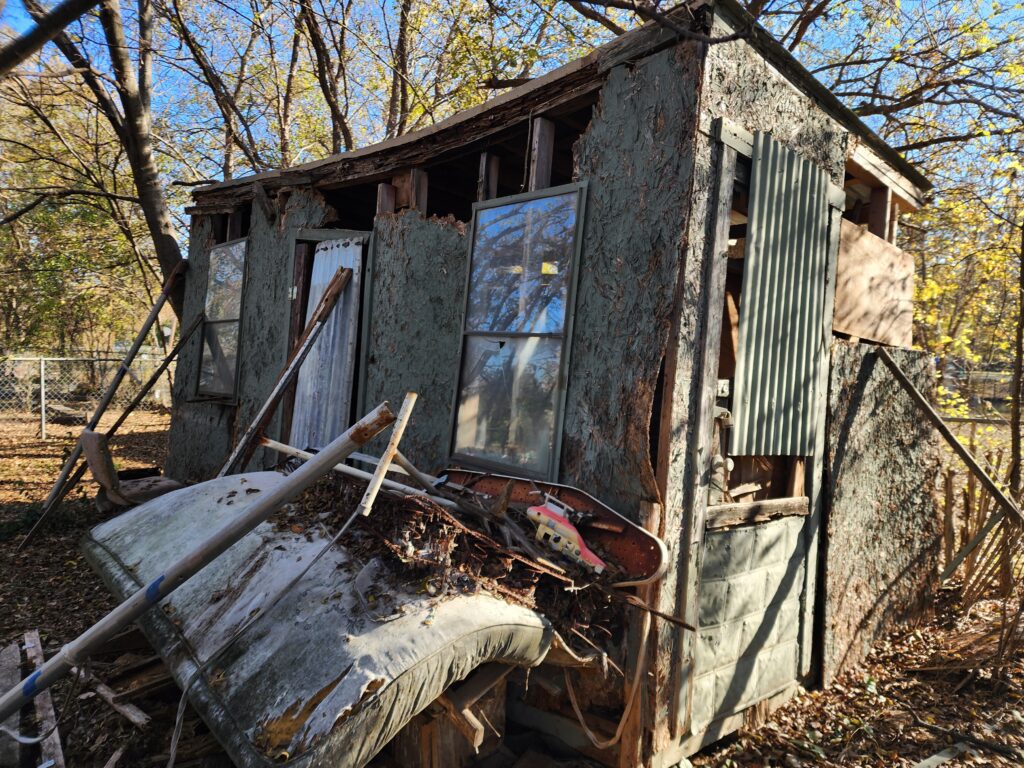 A old dilapidated shed, falling a part, a hazard on a property prior to demolition in Glen Rose