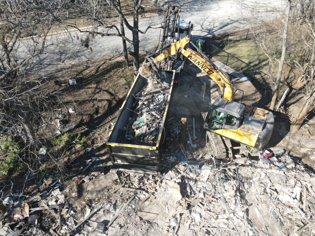 Aerial view of a hoarders home in Glen Rose being torn down by a professional demolition company