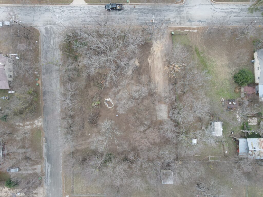 Aerial view of a cleared site following a demolition job in Glen Rose of a severe hoarding cleanup 