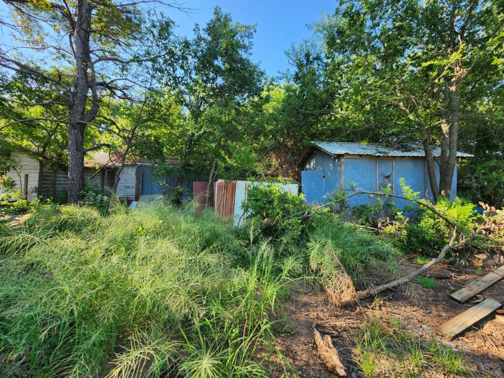 Dilapidated home that has been burned on the inside from a house fire prior to demolition